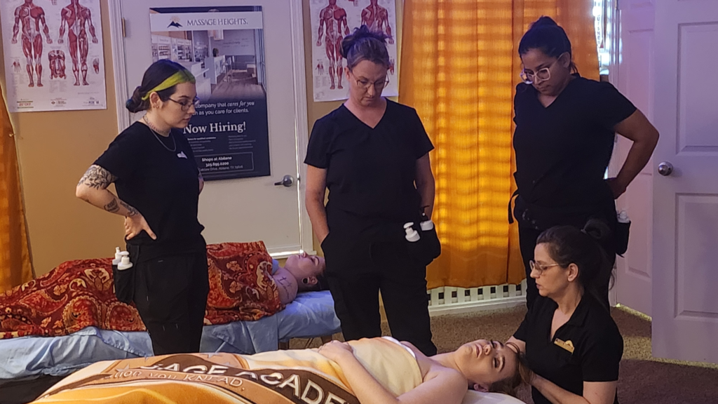 Kathleen teaching massage at Texas Massage Academy